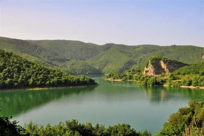 Hasanlar Dam Lake green forest shore and water