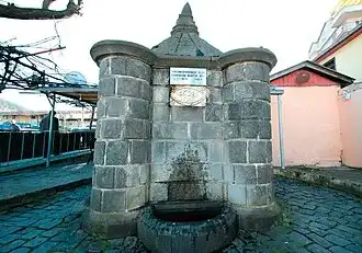 Full view of Muhtar Bey Fountain within the landscape