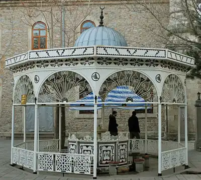 White metal ablution fountain in the common area of Merkez Yeni Mosque